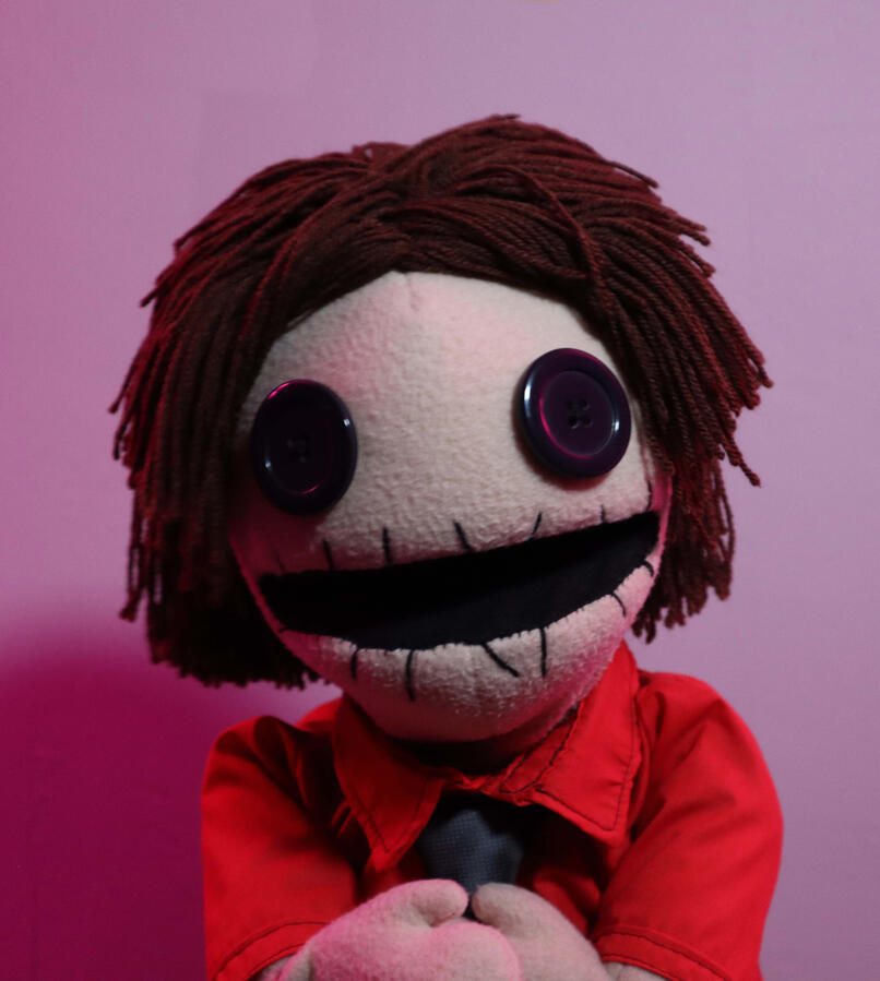 A hand-operated puppet that I made from scratch using sponge foam, various fabrics and a wool-made wig. Puppet includes a button-up shirt and a t-shirt made to fit a small character, as well as swappable arms for performance with live-hands and arm-rods.