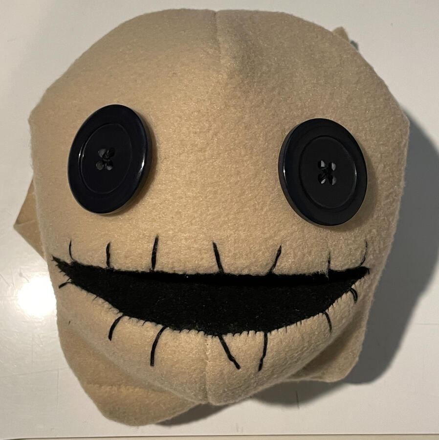 Button eyes and mouth stitching added