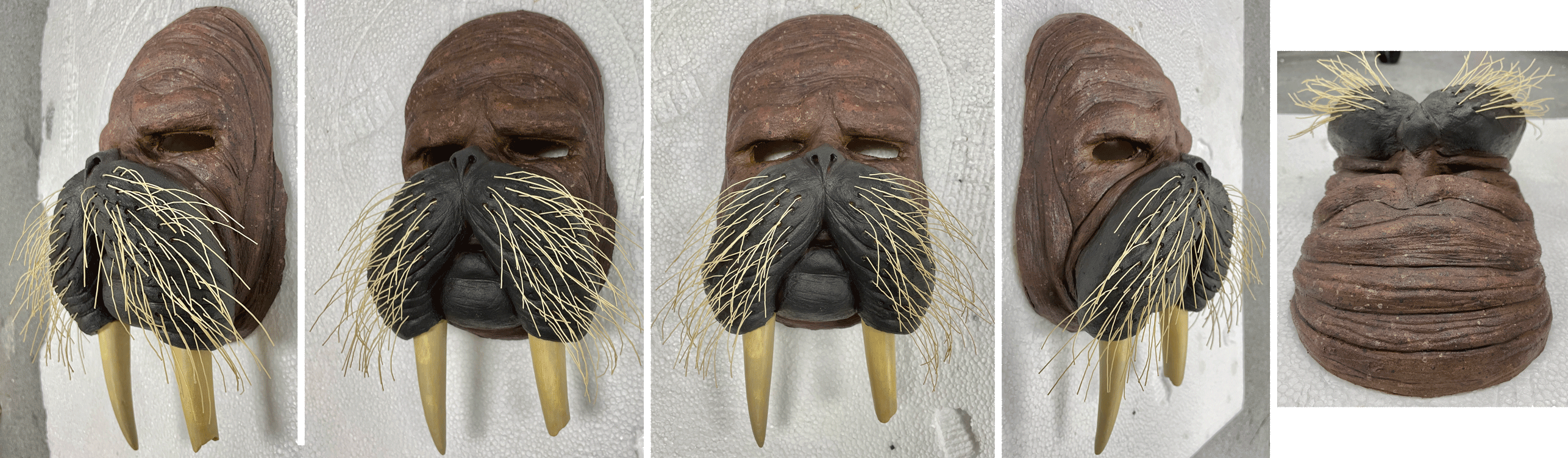 Painted and textured with acrylic paint. Whiskers created by gluing cut brush bristles into holes on the mask